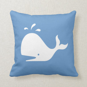 white CARTOON whale on blue pillow