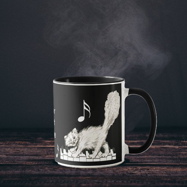 White Cat on Piano Keys Mug (White cat walking on piano keys music notes on black and white coffee or tea mug.)