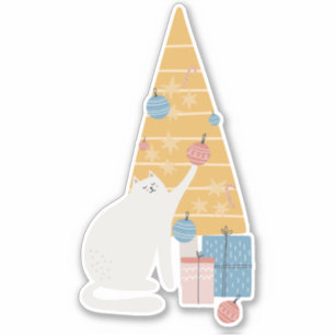 White cat plays with ornaments Christmas tree