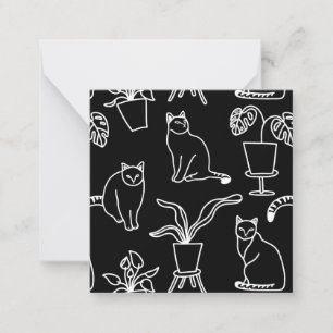 White cats on black card