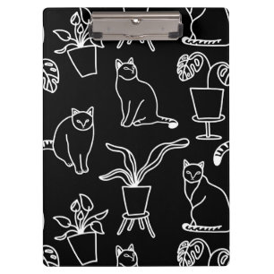 White cats on black clipboard