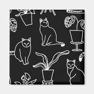 White cats on black magnet