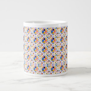 White ceramic mug featuring a colourful geometric