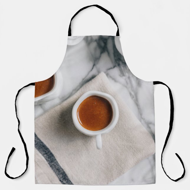 WHITE CERAMIC TEACUP FILLED WITH RED LIQUID APRON (Front)