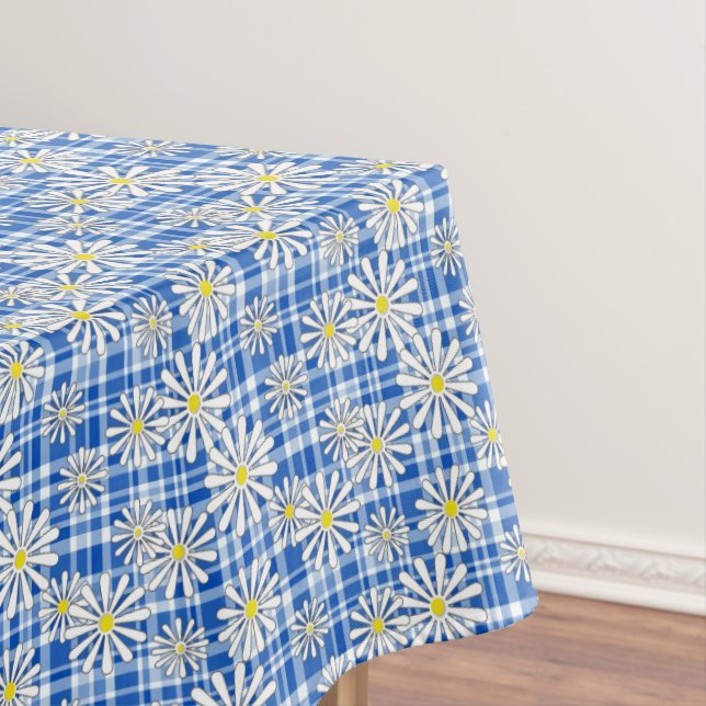 White chamomile flowers on a blue chequered backgr tablecloth (In Situ)