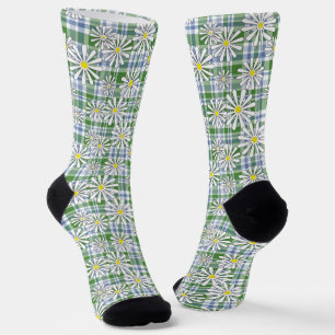 White chamomile flowers on a green blue chequered  socks