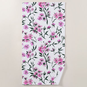 White cherry blossom on white beach towel