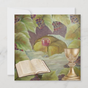 White cloth with wine and bread surounded by green holiday card