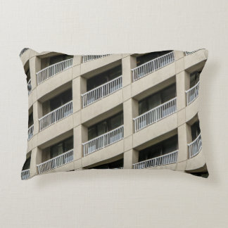 White concrete building during daytime decorative cushion
