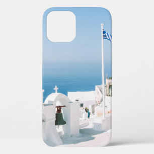 White concrete building near body of water in the iPhone 12 case