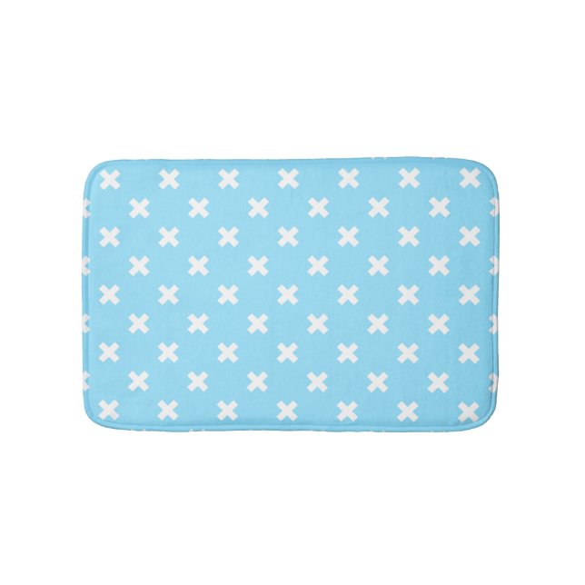 White cross stitches on baby blue bath mat (Front)