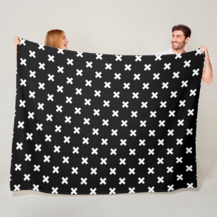 White cross stitches on black fleece blanket