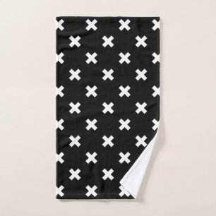 White cross stitches on black hand towel