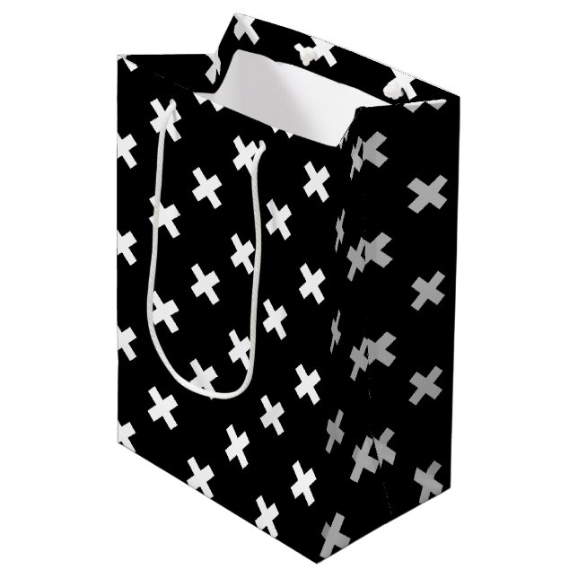 White cross stitches on black medium gift bag (Front Angled)
