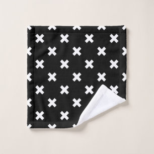 White cross stitches on black wash cloth