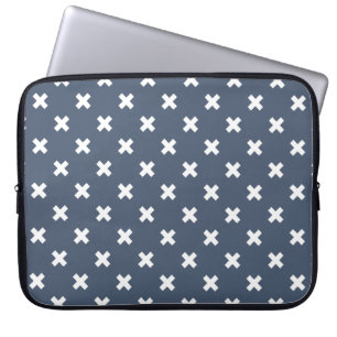 White cross stitches on blue-grey laptop sleeve