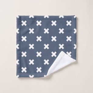 White cross stitches on blue-grey wash cloth