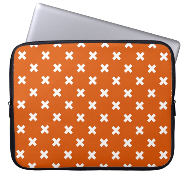 White cross stitches on burnt orange laptop sleeve (Front)