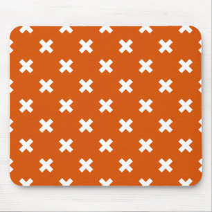 White cross stitches on burnt orange mouse mat
