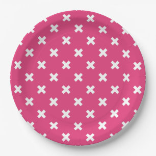 White cross stitches on fuchsia paper plate