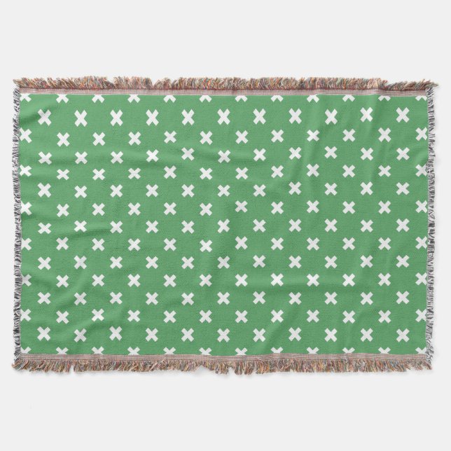 White cross stitches on green throw blanket (Front)