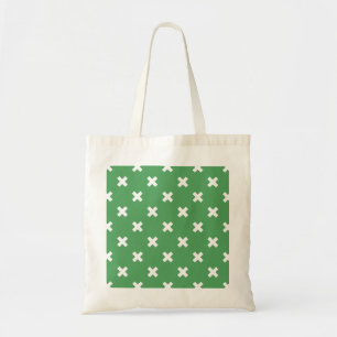White cross stitches on green tote bag