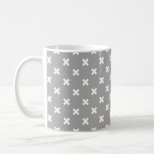 White cross stitches on grey coffee mug