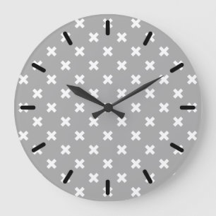 White cross stitches on grey large clock