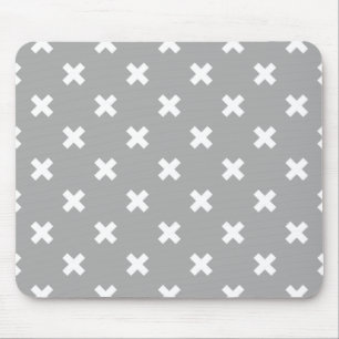 White cross stitches on grey mouse mat