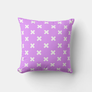 White cross stitches on lilac cushion