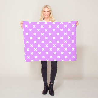 White cross stitches on lilac fleece blanket