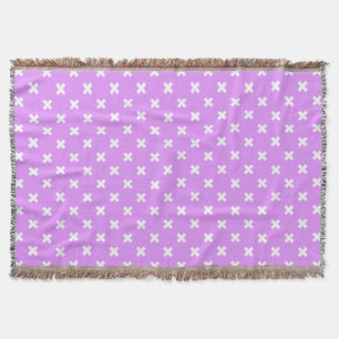 White cross stitches on lilac throw blanket