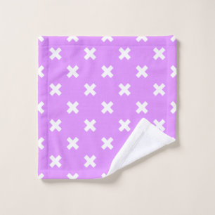 White cross stitches on lilac wash cloth