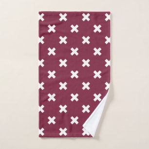 White cross stitches on mulberry hand towel