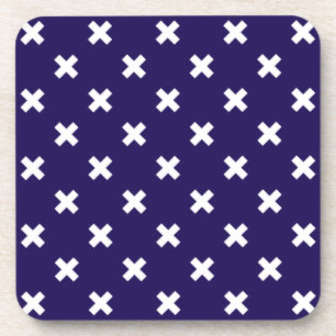 White cross stitches on navy blue coaster