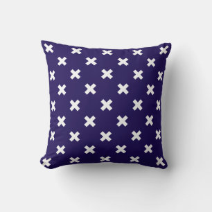 White cross stitches on navy blue cushion