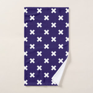White cross stitches on navy blue hand towel