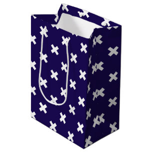 White cross stitches on navy blue medium gift bag