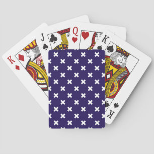 White cross stitches on navy blue playing cards
