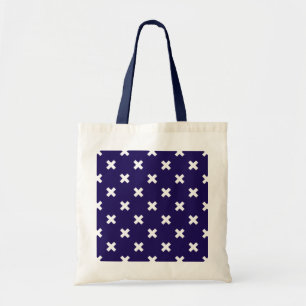 White cross stitches on navy blue tote bag