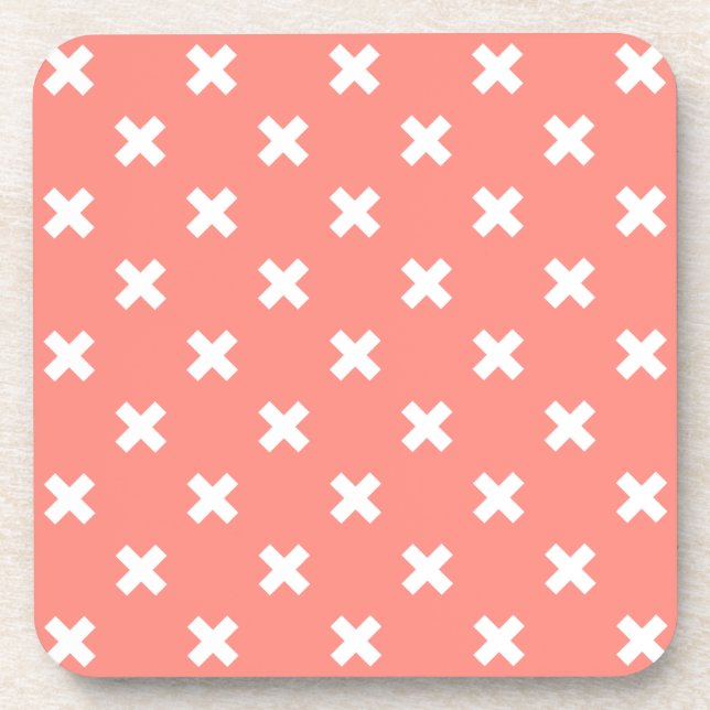 White cross stitches on peach coaster (Front)