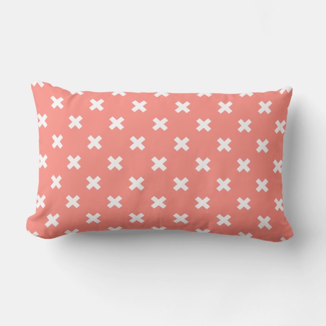 White cross stitches on peach lumbar cushion (Front)