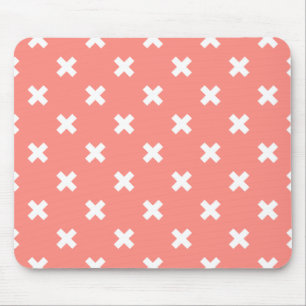 White cross stitches on peach mouse mat
