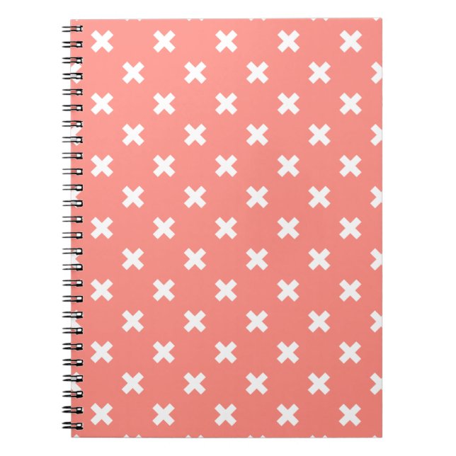 White cross stitches on peach notebook (Front)