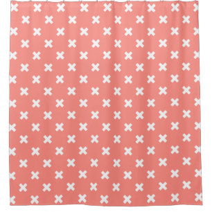 White cross stitches on peach shower curtain
