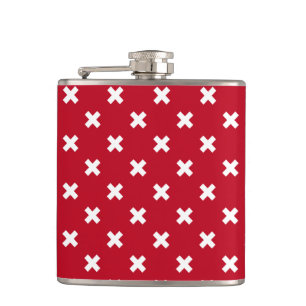 White cross stitches on red hip flask