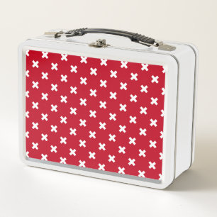 White cross stitches on red metal lunch box