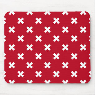 White cross stitches on red mouse mat