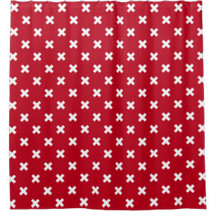 White cross stitches on red shower curtain