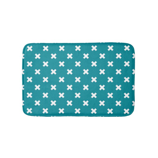 White cross stitches on teal bath mat (Front)